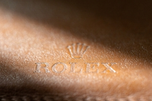 Rolex stampled leather logo