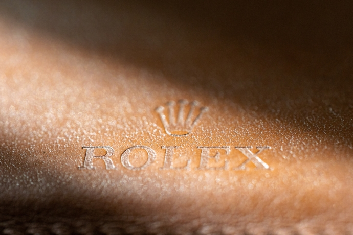 Rolex stampled leather logo