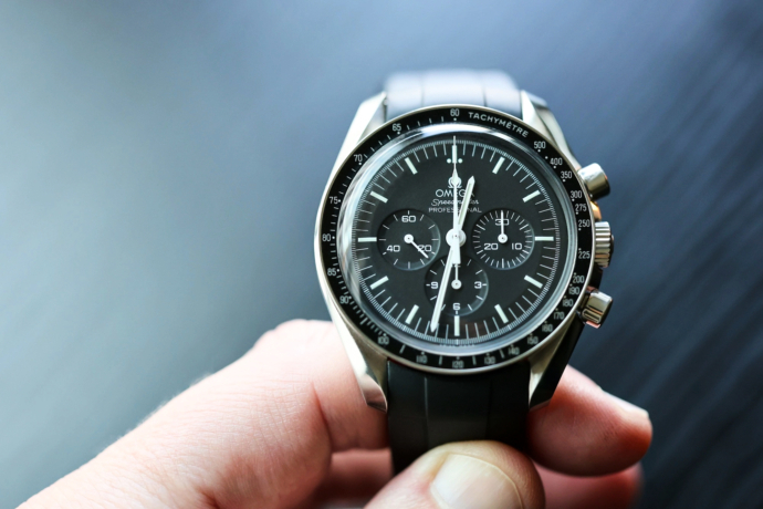 Omega Speedmaster Professional Moonwatch on Perpetual Black FKM rubber strap in hand